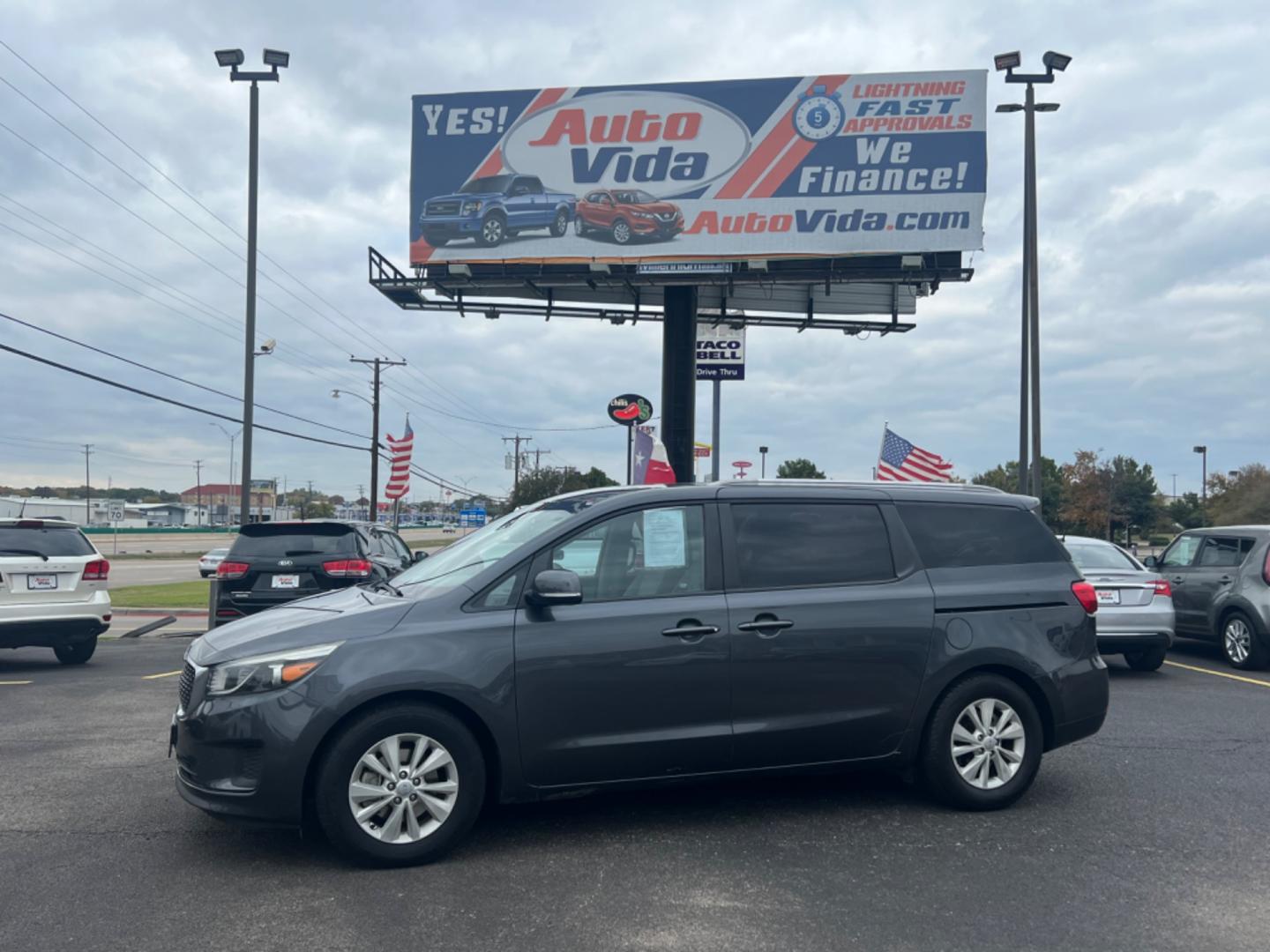 2016 GRAY Kia Sedona LX (KNDMB5C18G6) with an 3.3L V6 DOHC 24V engine, 6-Speed Automatic transmission, located at 420 I-35E, Lancaster, TX, 75146, (469) 297-4144, 32.593929, -96.823685 - Photo#0